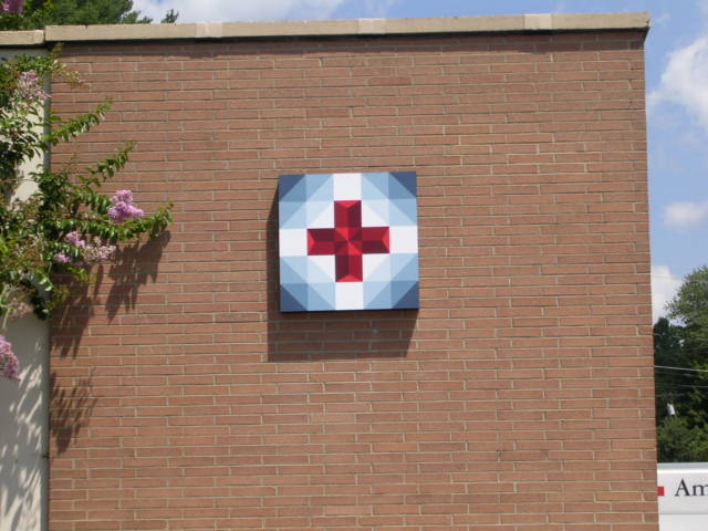 image of quilt block called Claras Red Cross Of Service